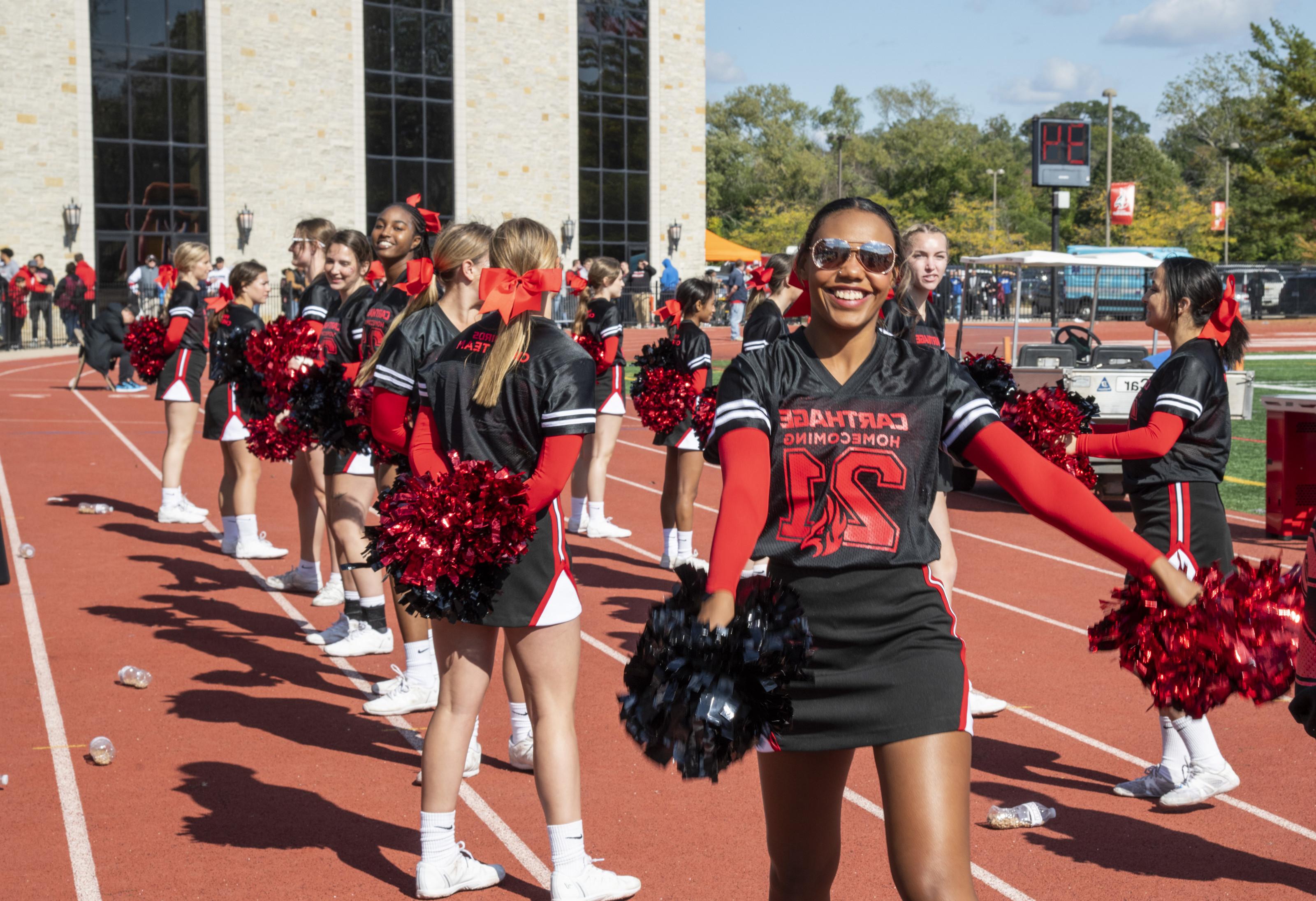 The Carthage Spirit Team cheers on the Firebirds.